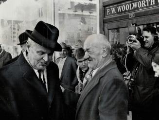 Prime Minister Diefenbaker met friend on stroll down Prince Albert main street Saturday afternoon greeting constituents