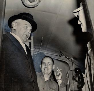 Get in there and show them who is boss, said Fred Titley, engineer of CPR switching engine, when Prime Minister Diefenbaker climbed aboard today to sh(...)