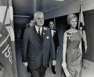 Diefenbaker with Mrs. F. J. Burford. Principal's wife escorts Tory leader