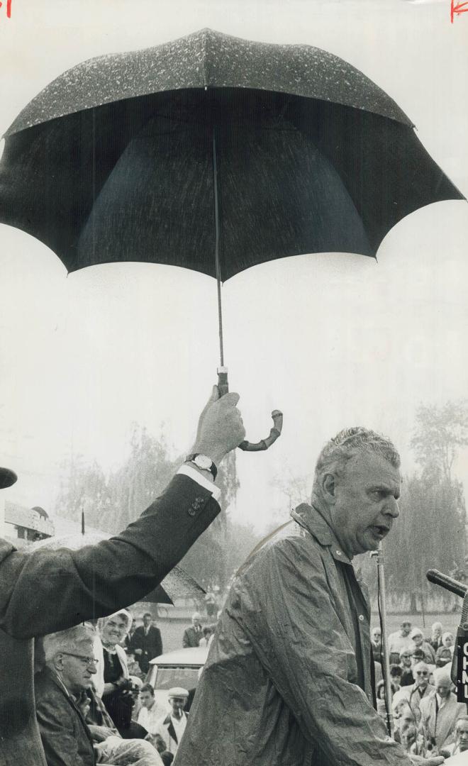 John Diefenbaker. Speaking in rain at Oakville picnic