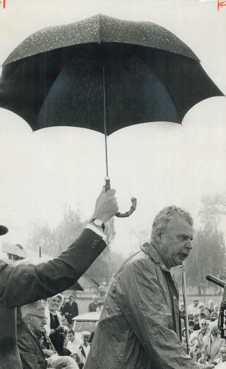 John Diefenbaker. Speaking in rain at Oakville picnic