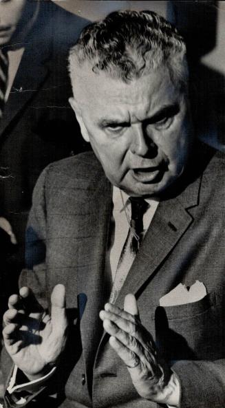Alternately outraged and amused, Opposition Leader John Diefenbaker attacked Prime Minister Pearson at a press conference in Toronto today for pussy-f(...)