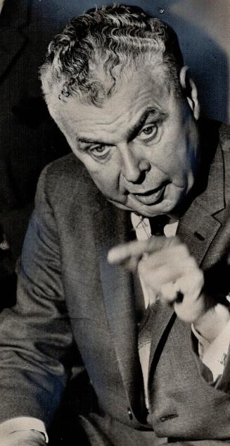 Alternately outraged and amused, Opposition Leader John Diefenbaker attacked Prime Minister Pearson at a press conference in Toronto today for pussy-f(...)