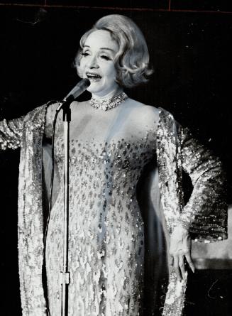 Marlene Dietrich opened her show at the Royal York Hotel last night but reviewer Frank Rasky suggests she should retire so fans could retains that eve(...)