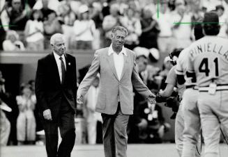 All-Time Greats: Joe DiMaggio, left, and Ted Williams are honored in a presentation with NL manager Lou Piniella and others before last night's game