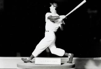 Golden moments: A card bearing Roberto Clemente's signature and a Joe DiMaggio figurine, right, are each worth $1,000, while a cheque bearing Babe Ruth's signature is worth $3,500