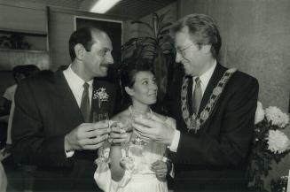 A marriage made in . . . the mayor's office. Alderman Betty Disero, 30, and her new groom, 32-year-old Sadegh Ghazanchale, toast their history making (...)
