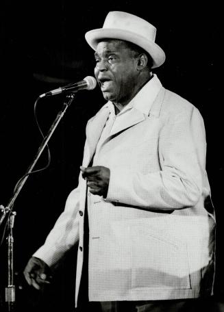 Willie Dixon is teaching Butch and the other 12 kids that father knows best