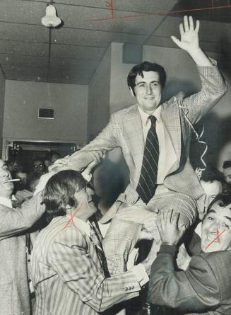 Dr. Martin Dobkin, 31, a newcomer to politics who was elected mayor of the new city of Mississauga last night, is lifted ont he shoulders of supporter(...)