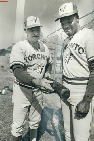 Advice pays off. Toronto Blue Jays' bating instructor Bobby Doerr (left) had timely tips for outfielder Alvis Woods before Jays took field against Chi(...)