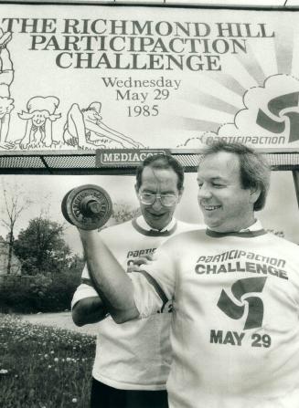 Mayor flexes for fitness. Richmond Hill Mayor Al Duffy is flexing his muscle with Peter Armstrong, a Mediacom billboard company executive, measuring. (...)