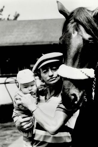 Two of his favorites. Jockey Lloyd Duffy was showing a lot of pride yesterday at Woodbine racetrack when he took son Patrick for a close-up look at S.(...)