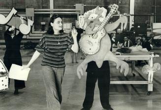 Dianne Dupuy directs Philip Blair as he handles a puppet