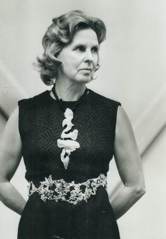 Mrs. John David Eaton models belt by Judith Brown of Reading, Vermont, and pendant sculptured by Gabrielle Kennedy of New York