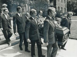 At funeral of Lady Eaton, grandsons acting as pallbearers carry casket from the Timothy Eaton Memorial Church on St