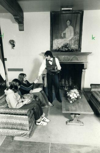 Lady Eaton herself looks down from a portrait in the lobby of her former home, where Colin Mummery serves drinks to Nicole Larente (left) and Karen Sm(...)