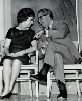 Mrs. Edward Dunlop with George Hees. Her husband seeks re-election in Forest Hill