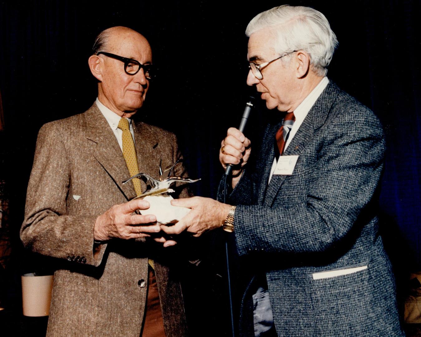 Star's Milt Dunnell honored. Milt Dunnell, left, veteran Star sports columnist who turned 80 last Christmas Eve, was given a presentation at last nigh(...)