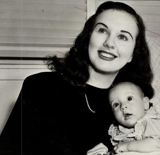 Canda's Deanna Durbin, a veteran of 10 years and 18 feature films in which she has sung 73 songs, is seen with her daughter, Jessica Louise