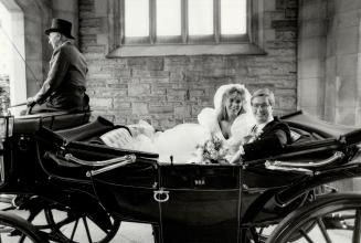 A wedding in the Eaton style. Henry Eaton and Victoria gordon, both 24, leave Timothy Eaton Memorial Church in a landau after their marriage yesterday(...)
