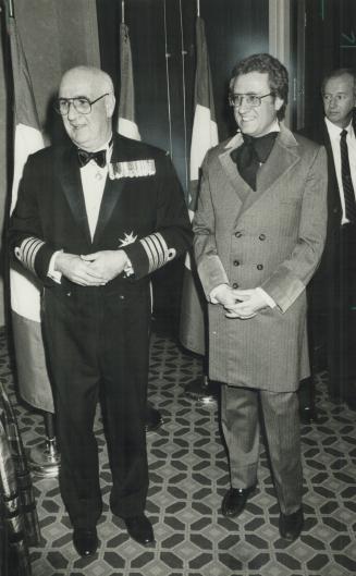 Viceroy joins in: Lieutent-Governor John Black Aird, a wartime naval veteran, wears naval captain's uniform, as he accompanies toronto Mayor Art Eggletion in period costume to the celebrations