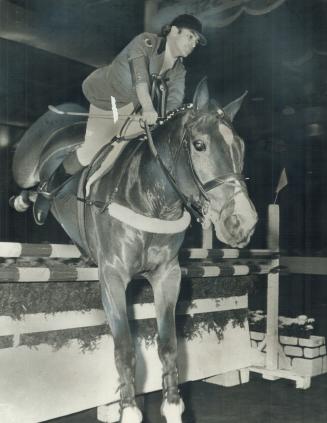 Up and over at the Royal. Jim Elder, aboard Houdini, clears the last jump in international jumping competition at opening of Royal Winter Fair in Toro(...)