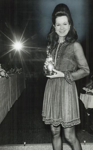 Judy award to The Toronto Star, for coverage of every segment of fashion world, was accepted last night by Stasia Evasuk. It was one of 13 awards presented