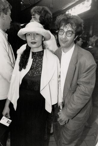 Classy couple: Despite troubles at the screening of Speaking Parts director Atom Egoyan, seen here with his lady, Arsine Khanjian, managed a thin smile for the camera