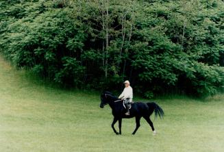 At his Aurora horse farm