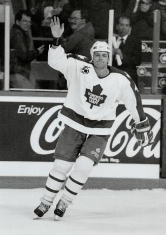 First star: Maple Leaf defenceman Dave Ellett acknowledges the cheers from the crowd after being named the first star for scoring game winner