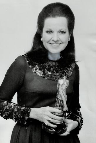 Stasia Evasuk, The Star's fashion writer, with the Judy award presented to her night by the Garment Salesmen Ontario Market for The Star's consistent,(...)