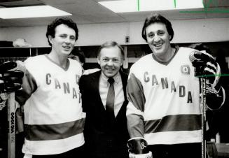 Phil Esposito (right) with Paul Henderson (left) and Yvan Cournoyer