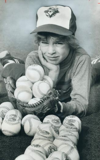 Kids will have a ball. Pat Fairly, 8, son of Blue Jays' Ron Fairly, juggles a few of the 25,000 special baseballs that will be given out to youngsters(...)