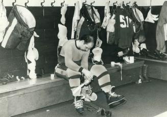 End of the road: Maple Leaf defenceman Dave Farrish hangs his head in the Leaf dressing room last night after Minnesota North Stars eliminated Toronto from the Stanley Cup playoffs