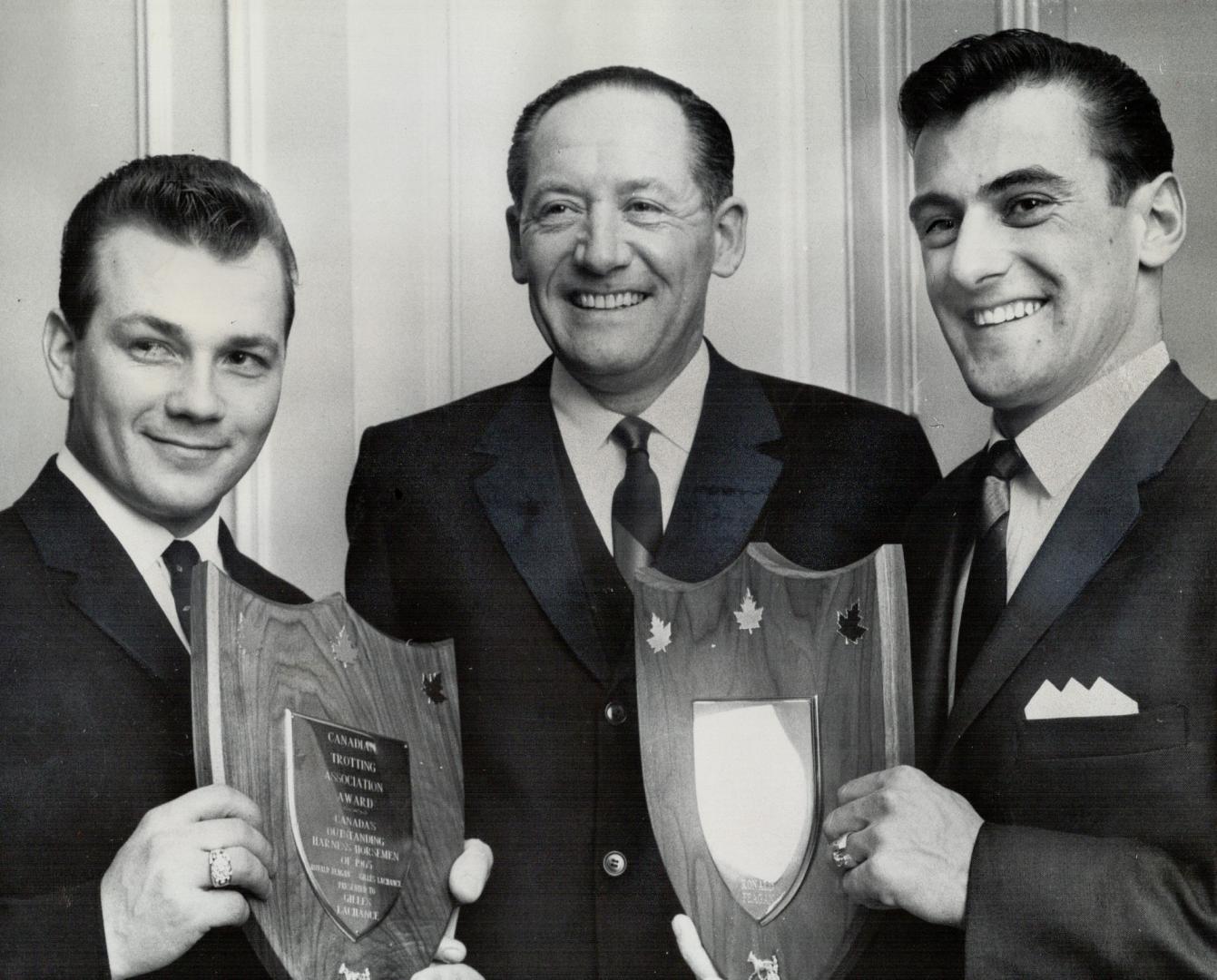 Sulky Elite honored. Gilles Lachance of Montreal (left), winner of 206 races last season, and Goderich's Ron Feagan, who hit 213 times, receive plaque(...)