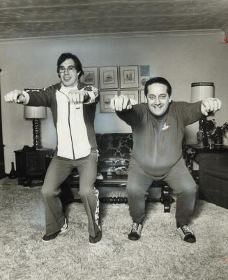 Indoor exercise routine is performed in his living room by Mayor Dennis Flynn of Etobicoke