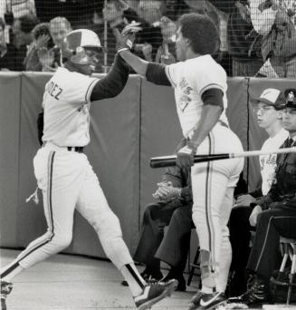 High five! A joyful Tony Fernandez is congratulated by George Bell after scoring the goahead run in the fourth inning of last night's AL championship (...)