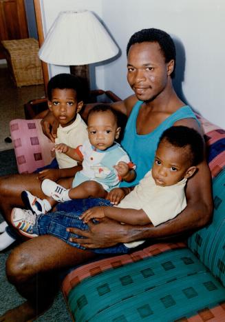 Blue Jays shortstop Tony Fernandez poses at his home in the Dominican Republic with sons (left to right) Joel, 4 1/2, Abraham, seven months, and Jonat(...)