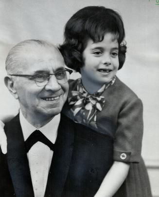 Mr. Conciliation, Louis Fine gets a hug from granddaughter Joy, 6, daughter of Mr. and Mrs. Harry Fine, at Royal York testimonial dinner last night at(...)