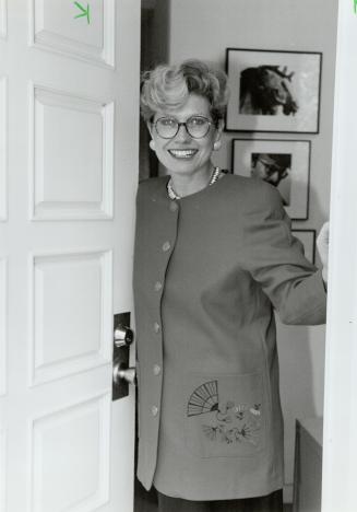 Getting out: Susan Fish smiles from the front door of her home today after announcing her withdrawal from the Toronto mayoral race