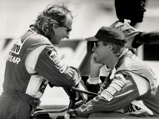 Emerson Fittipaldi (left, above) and Danny Sullivan have a laugh at Detroit, but the Penske teammates didn't do so well as Emo finished eighth and Sullivan 14th