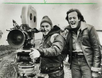 Peter Fonda shares an observation with director of photography Rene Verzier, on set of Highballin', an adventure movie about trucks being filmed in th(...)