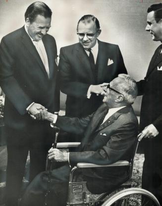 The grandson of Ford's founder, Henry Ford II, head of the parent Ford firm, greets A
