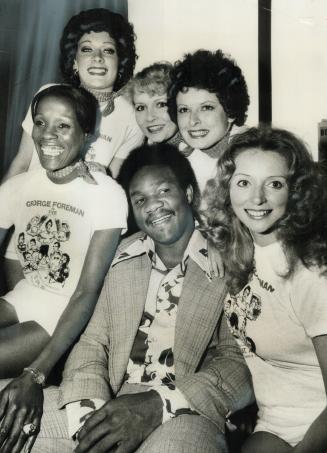 Foreman and his cheerleaders. George Foreman, former world heavyweight boxing champion, has his own cheering section (left to right), Jo Jo Deville, A(...)