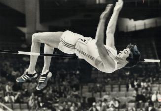 High-jumper Robert Forget of montreal clears the bar in his record leap