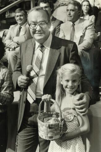 Harvey Kirck with Lisa LeBourdais, 9, who went out and collected $146