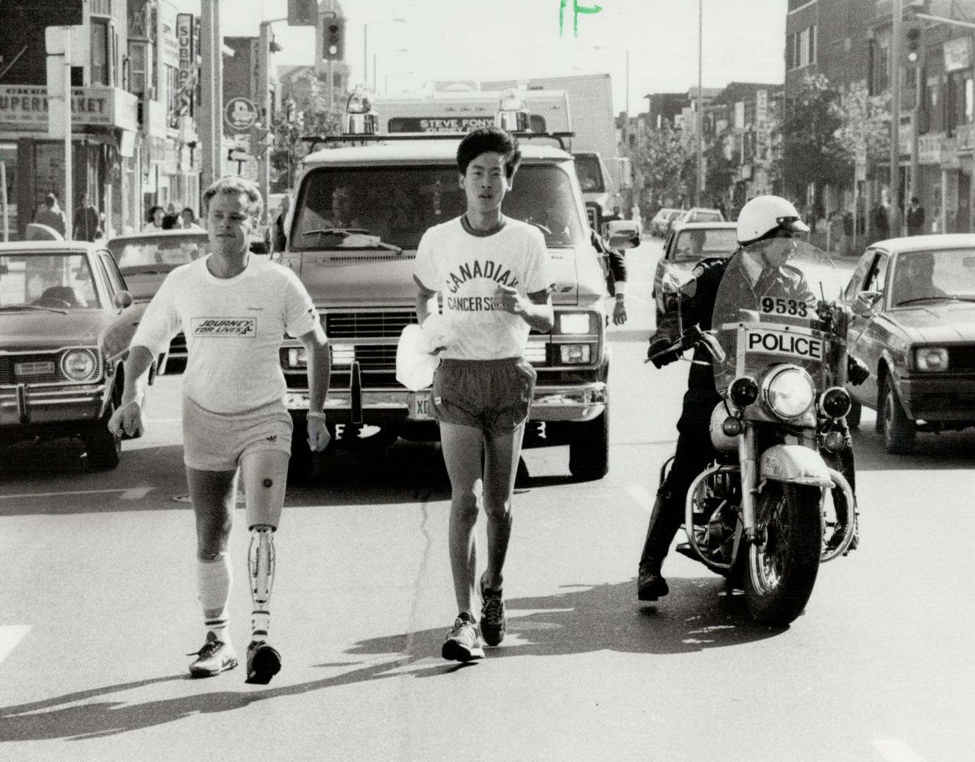 Great effort! Journey for Lives runner Steve Fonyo, who reader calls an example of courage and willpower, runs down the Danforth en route to Queen's Park yesterday