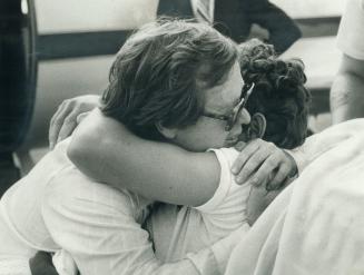 Bill Vigars, friends and Marathon of Hope wagonmaster, gives Terry a tearful hug