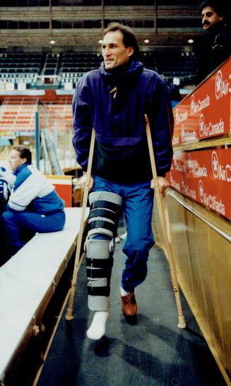 Not ready yet: Mike Foligno, the Leaf winger who broke his leg in December, visits the Gardens yesterday, but is still a long way from returning to the lineup