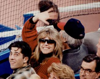 Below: Blowout had actress Jane Fonda giving high fives instead of praying